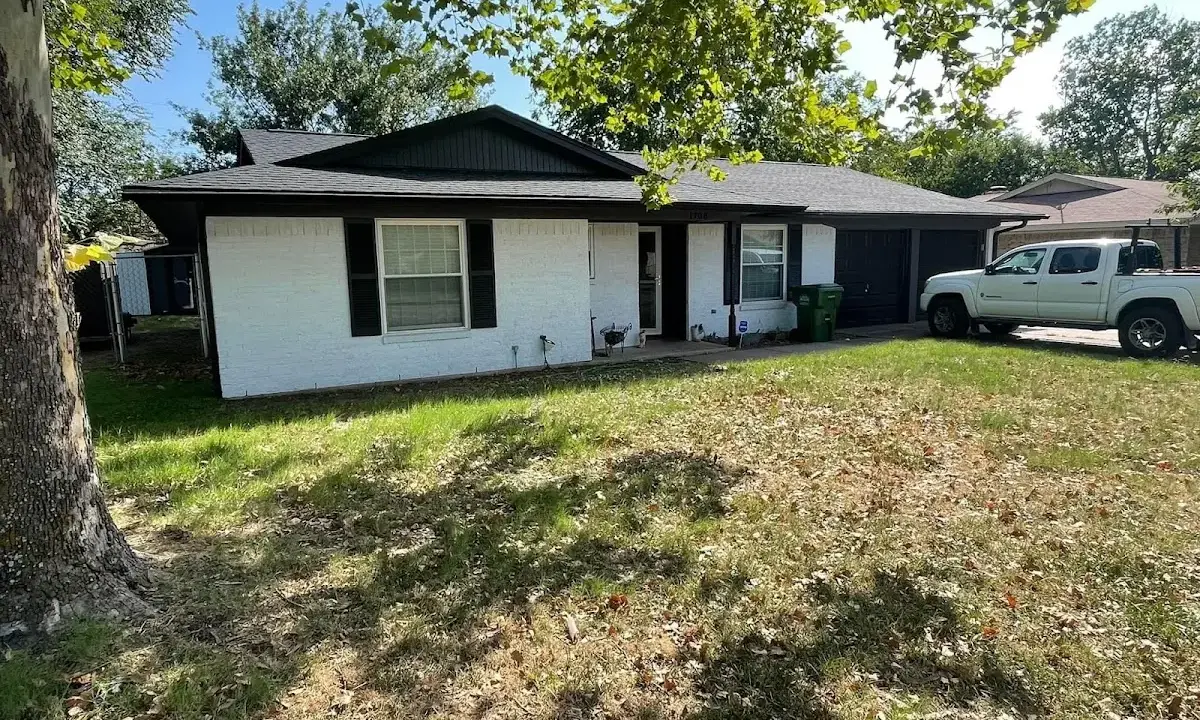 Professional roofing crew working on a residential roof in Salem